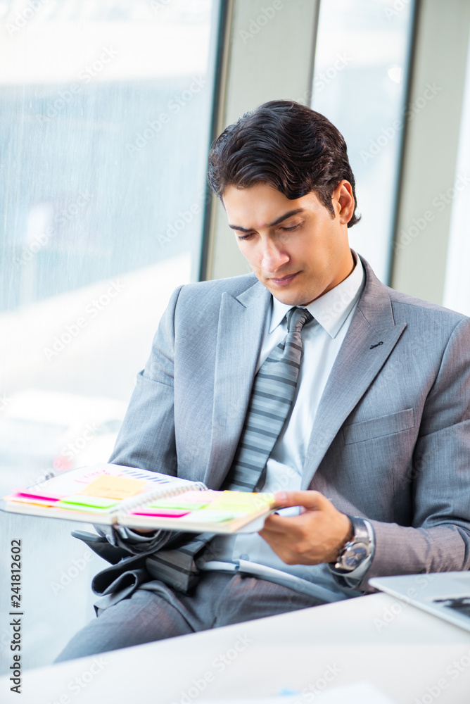 Young successful businessman working at the office Young successful businessman working at the office