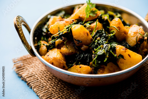 Fenugreek potato sabzi or Aloo Methi masala is healthy Indian Cuisine. served in a bowl or karahi. selective focus photo