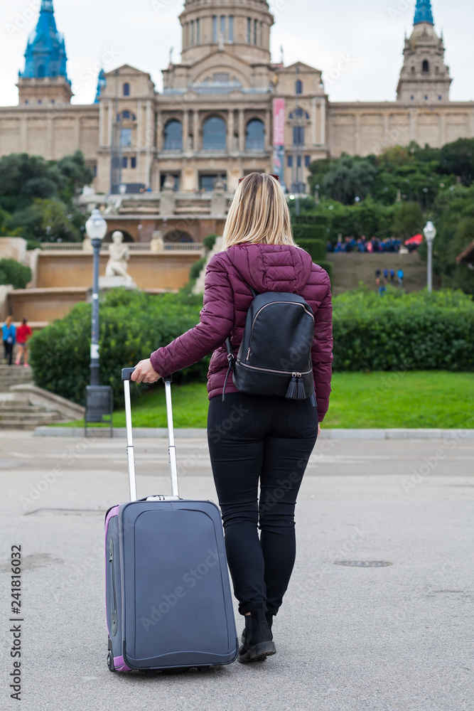 Female tourist with luggage