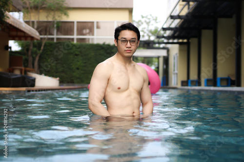 asian man wearing glasses in swimming pool