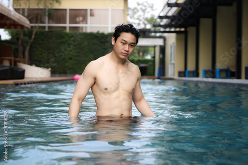 asian man wearing glasses in swimming pool