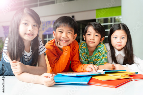 Asian Little Children Reading Book Cheerful