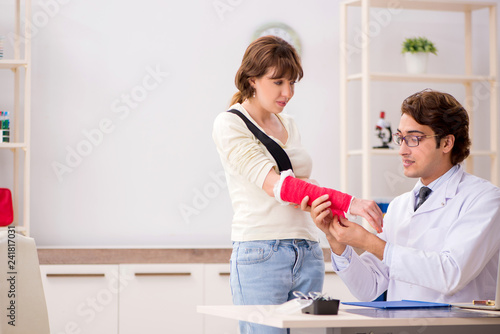 Young woman visiting doctor traumatologist 