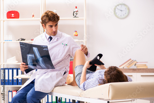 Male traumatologist looking at xray images  