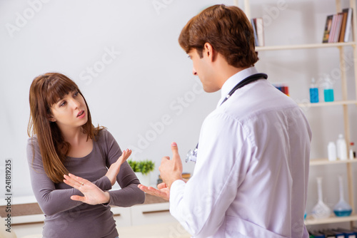 Deaf-mute female patient visiting young male doctor 