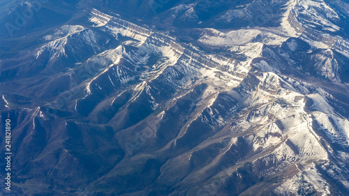 Mountain ranges, view from the plane. Window seat