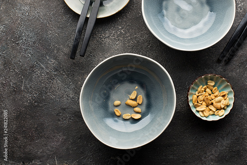 Fotografija Gray serving plates on a dark gray background for serving lunch
