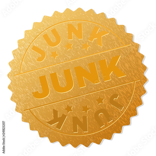 JUNK gold stamp award. Vector golden award with JUNK tag. Text labels are placed between parallel lines and on circle. Golden skin has metallic effect.