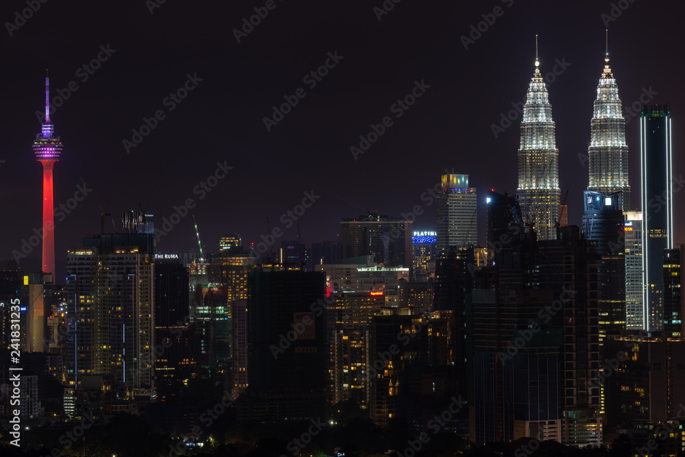 KUALA LUMPUR, MALAYSIA - 31st DEC 2018; Night view of downtown Kuala Lumpur, a capital of Malaysia. Its modern skyline is dominated by the 451m-tall Petronas Twin Towers.  