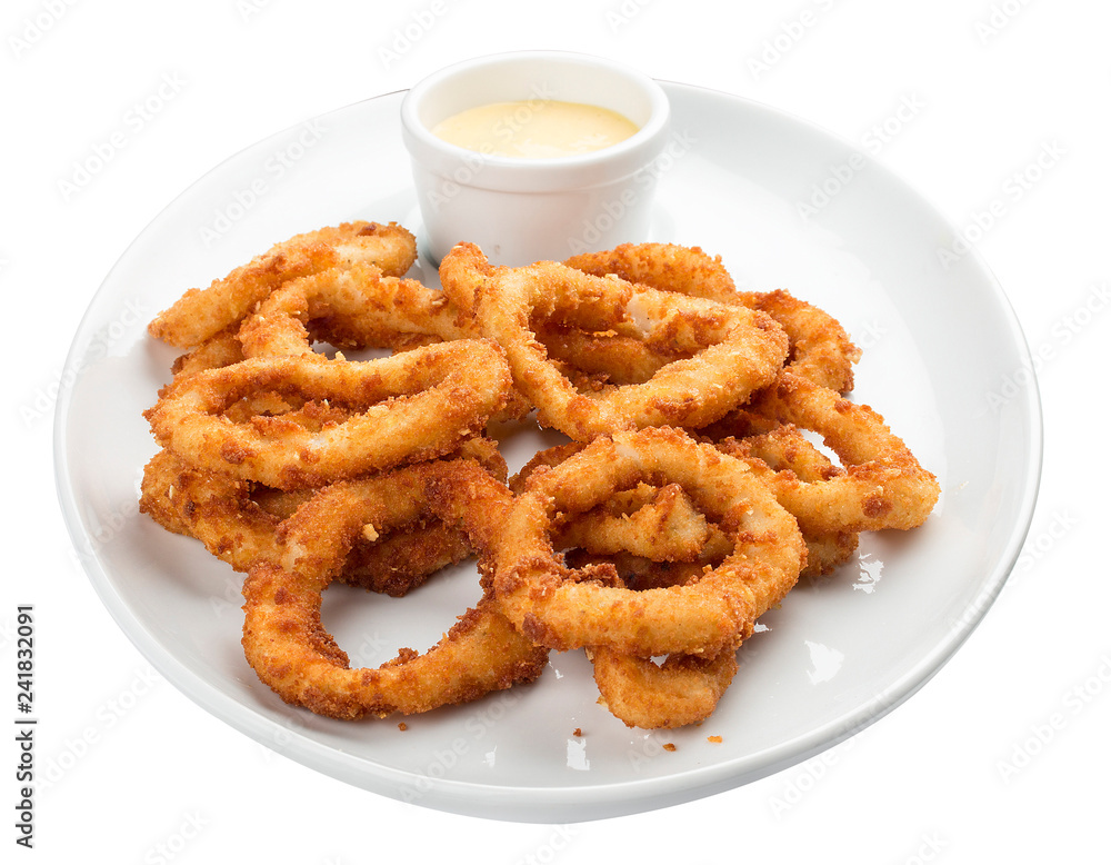 Squid rings, deep fried with sauce on white background Squid rings, deep fried with sauce on white background