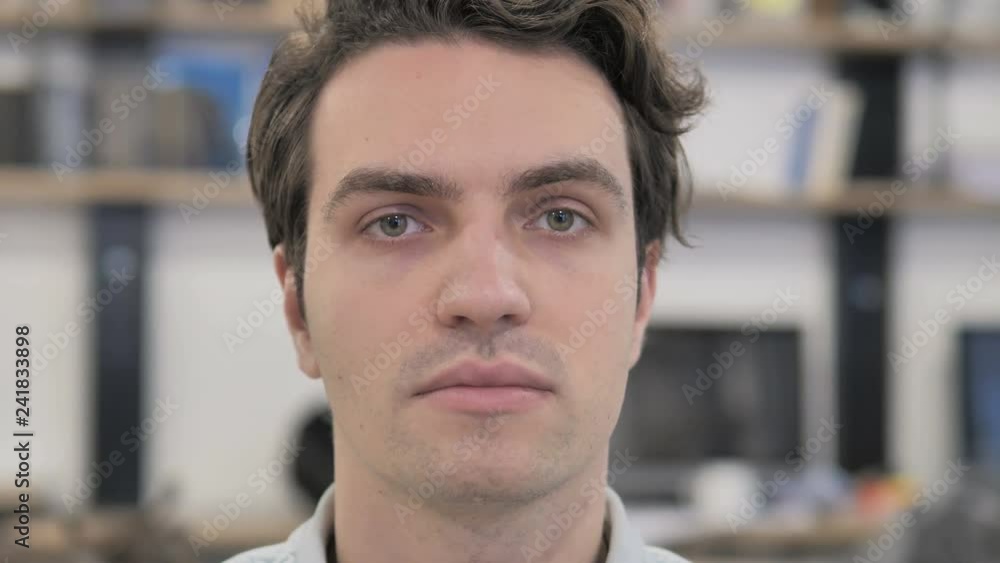 Close Up of Serious Creative Man Face Looking at Camera Close Up of Serious Creative Man Face Looking at Camera
