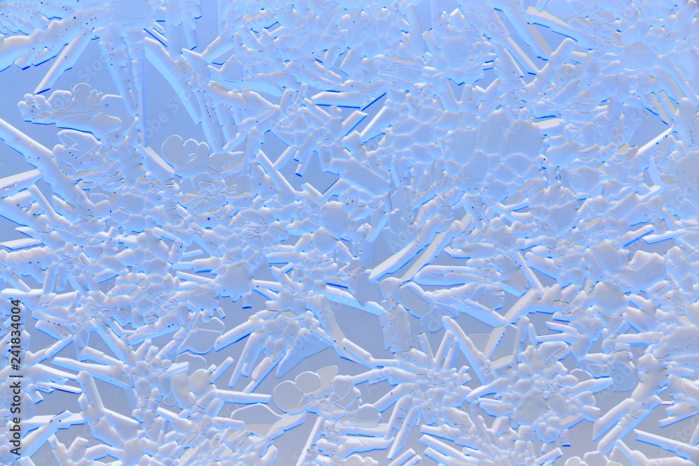 Snow patterns on glass as an abstract background Snow patterns on glass as an abstract background