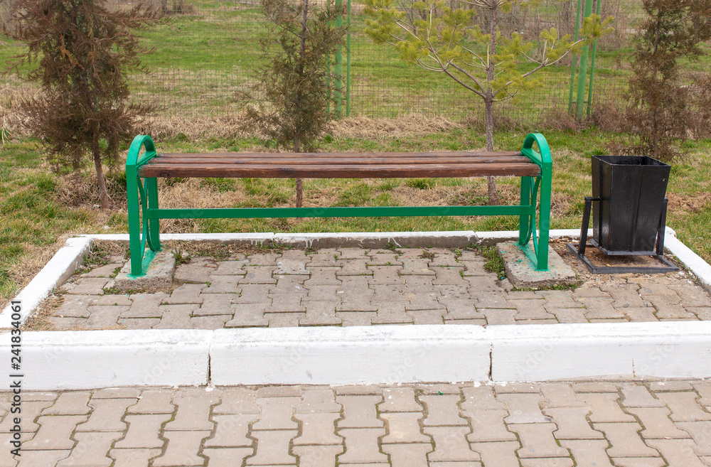 Wooden bench stands in the park