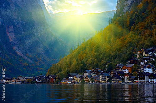 Sunrise over Hallstatt austrian alps resort and mountain village with traditional rural alps houses  restaurants  hotels and wooden boat houses at Hallstatt lake. Location  Hallstatt lake Austria Alps