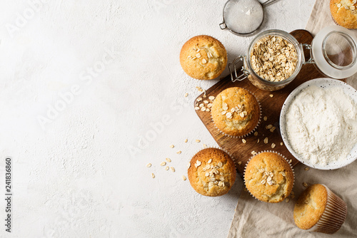 Homemade tasty oat miffins on white background