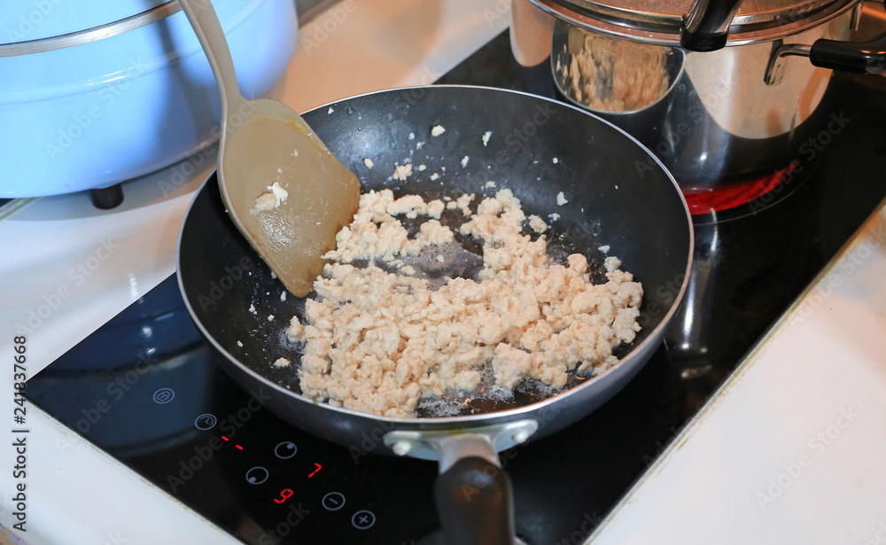 Chopped pork fried in a hot pan. Chopped pork fried in a hot pan.