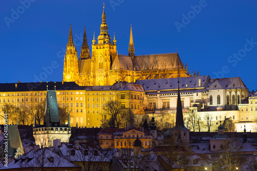 Night snowy Christmas Prague Lesser Town with gothic Castle above River Vltava  Czech republic
