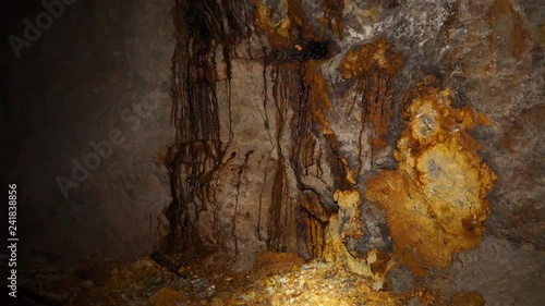 Uranium ore in a uranium mine. Rock containing uranium and barite. photo