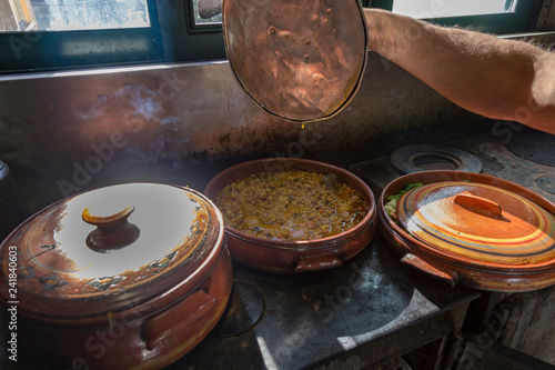 Drakona Greece, 12-14-2018 Traditional  Cretan cooking over a wood fire in Crete Greece.