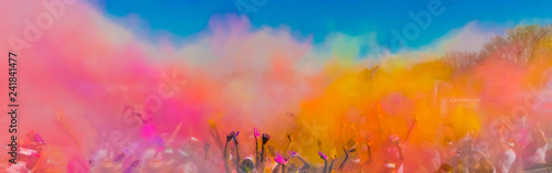 Fotografie, Tablou Crowd throwing bright coloured powder paint in the air, Holi Festival Dahan