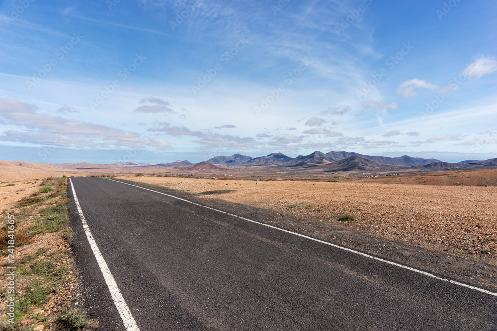 Lonely Road in the mountains. Fuerteventura. Canary Islands. Spain Lonely Road in the mountains. Fuerteventura. Canary Islands. Spain