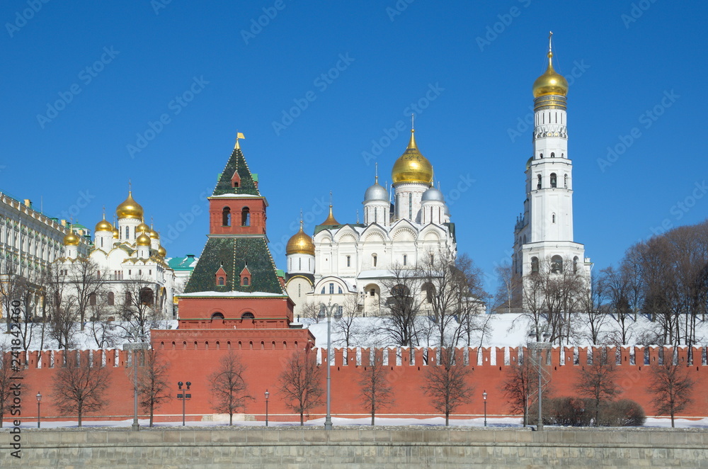 View of the Moscow Kremlin temples and the Kremlin embankment on a Sunny spring day, Moscow, Russia