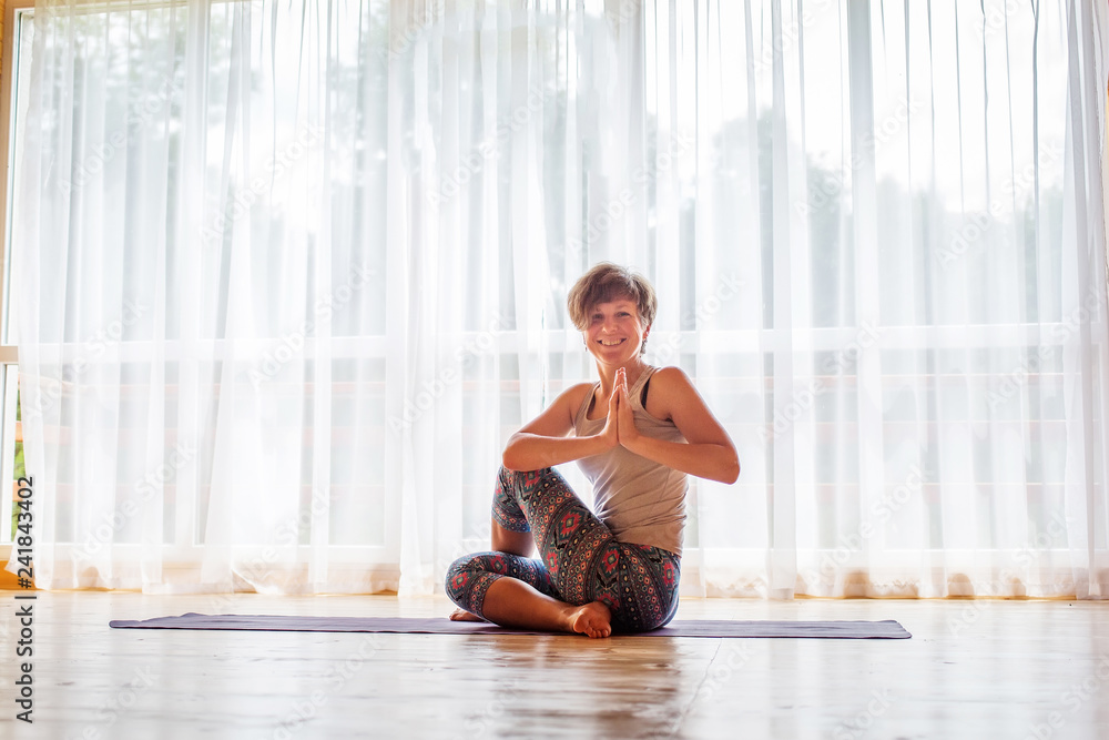 Caucasian woman is practicing yoga at studio Caucasian woman is practicing yoga at studio