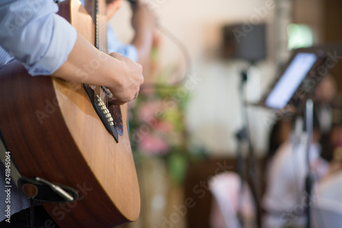 Musicians are playing acoustic guitar.In the party, Close up.