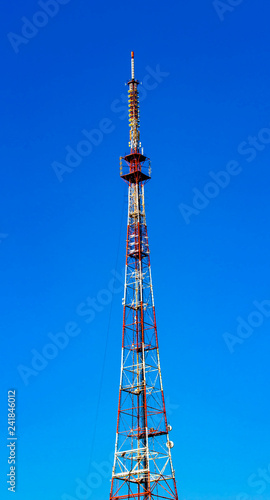 Telecommunication tower on blue sky © bborriss