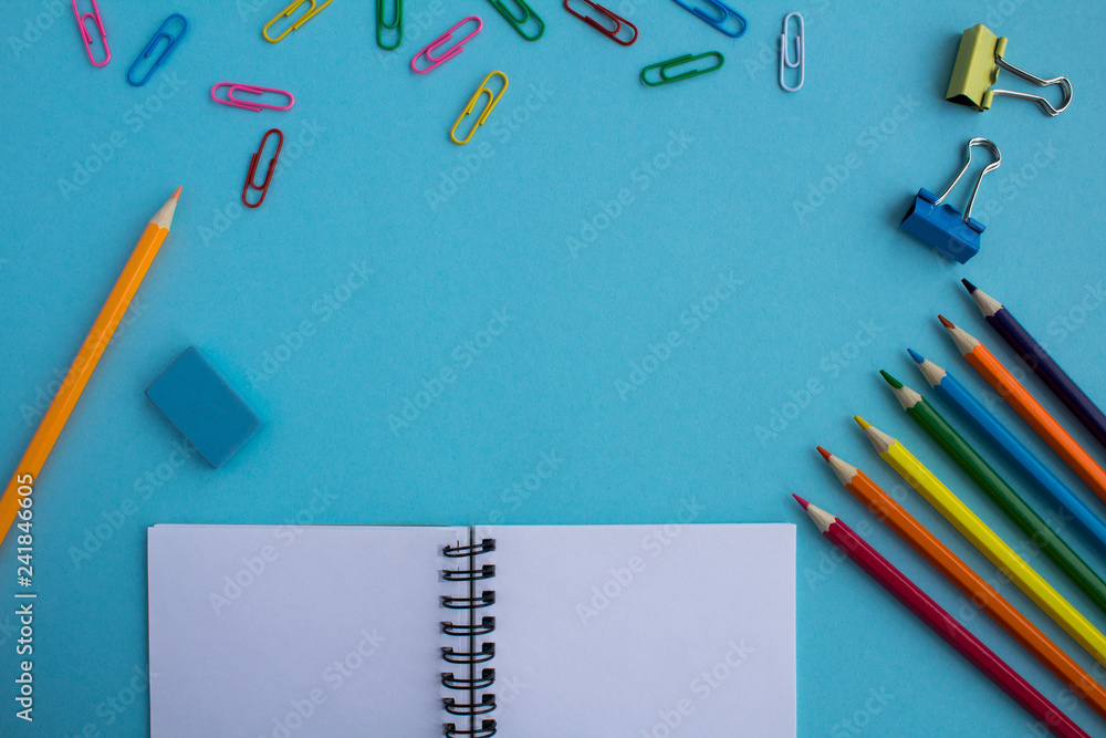 Top view of business office accessories on the blue background.Copy space. Top view of business office accessories on the blue background.Copy space.