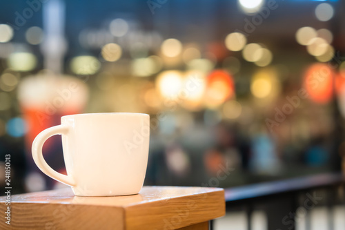 White coffe cup with lighting bokeh background
