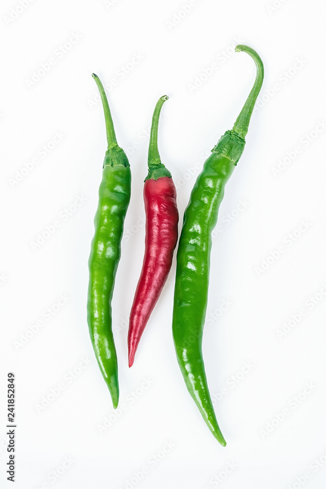 Red pepper and green pepper on white background Red pepper and green pepper on white background