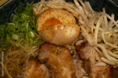 Typical Japanese soup noodles Ramen with egg and meat