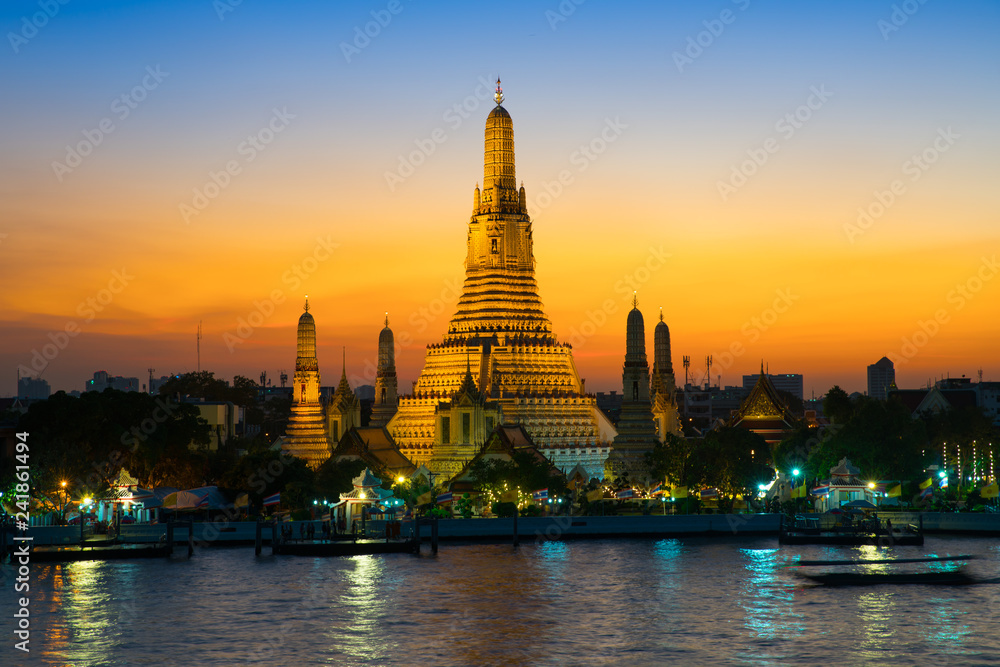 Sunset at Arun Temple or Wat Arun, locate at along the Chao Phraya river with a colorful sky in Bangkok, Thailand