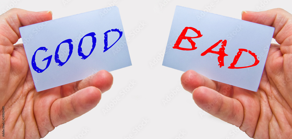 Fototapeta premium good and bad choice signs in man hands on a white background. for business and education concepts