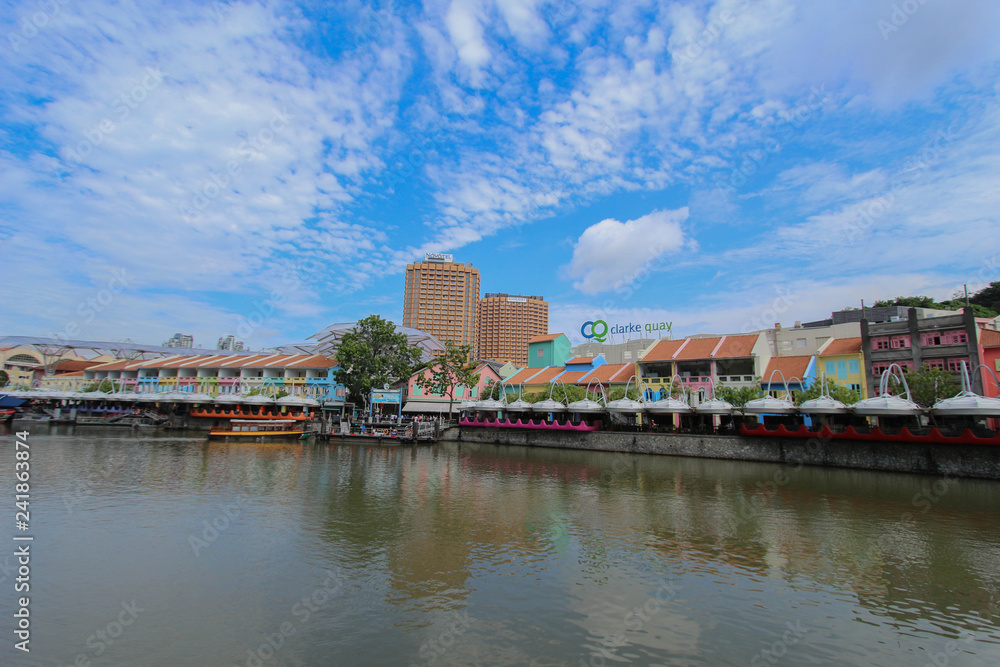 Historical quay on the Singapore River. Moored ships on the pier on September 25, 2016