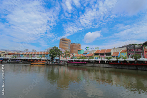 Historical quay on the Singapore River. Moored ships on the pier on September 25, 2016