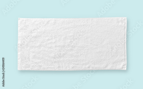 White cotton towel mock up template fabric wiper isolated on blue background with clipping path, flat lay top view photo