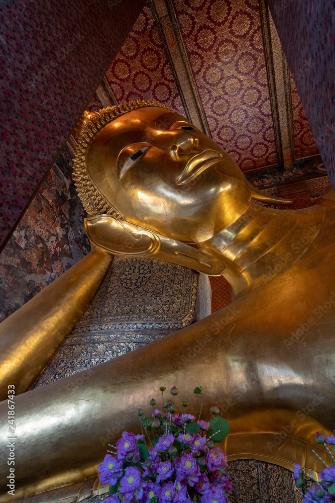 Vertical image of Reclining buddha face at Wat Po