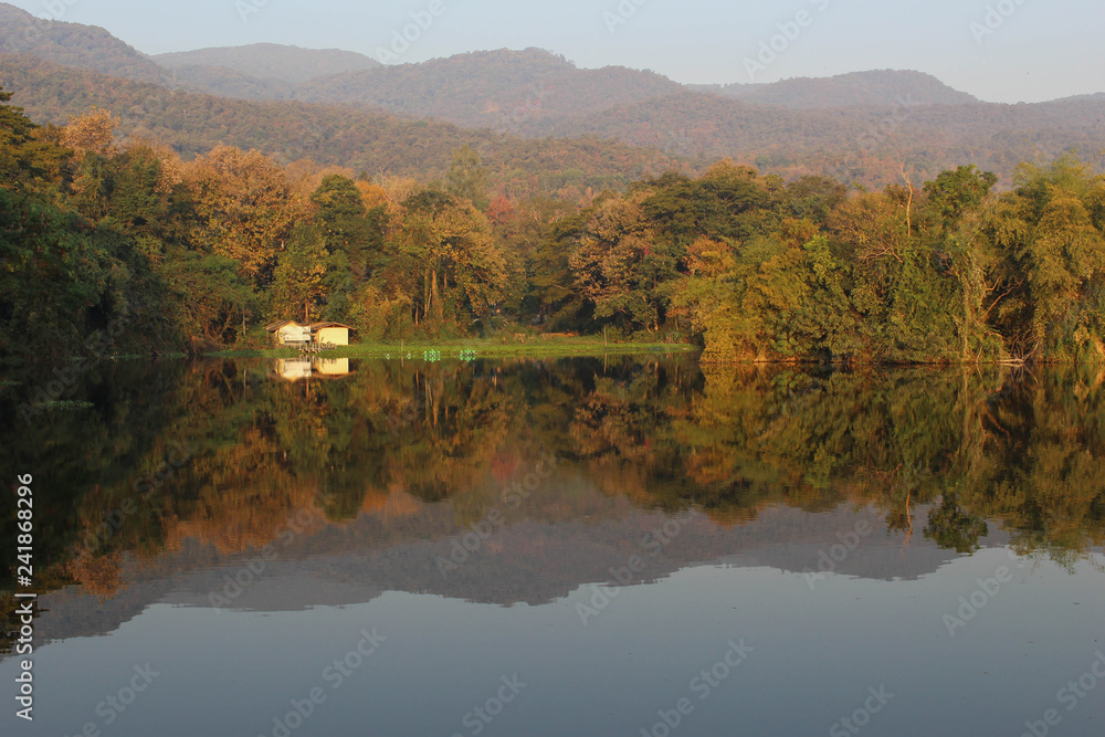 Ang Kaew Reservoir at Chiang Mai University in Thailand. mountain, sky soft and blur background