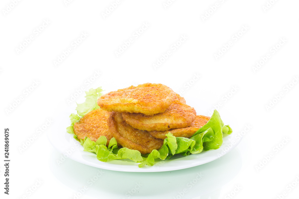 potato pancakes with lettuce leaves in a plate potato pancakes with lettuce leaves in a plate