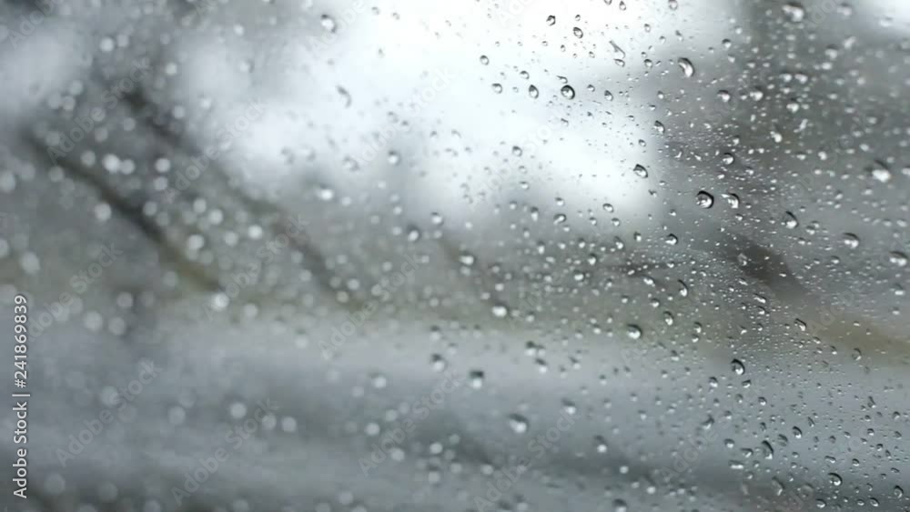 rain drops running on window car with blue lonely feeling rain drops running on window car with blue lonely feeling