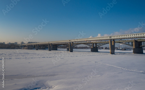 View from the embankment of the Ob River on the metro bridge in Novosibirsk, Russia