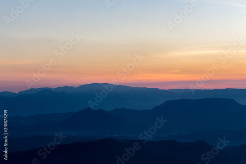 Sunrise view over mountains from a mountain peak. Mountains silhouette. Nature landscape. © Marija Krcadinac