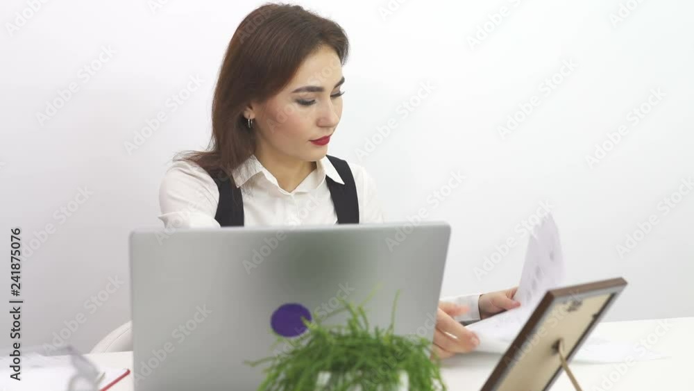 4К. Asian pretty business woman work at notebook in office. Dolly shot 4К. Asian pretty business woman work at notebook in office. Dolly shot