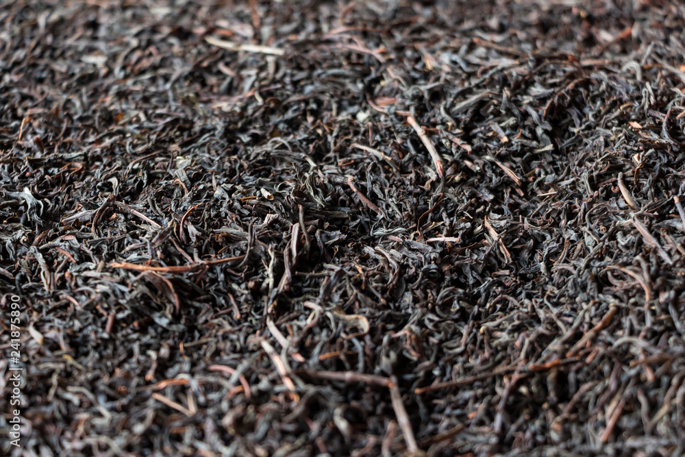 Black tea dried leaves macro background. Tea factory in Sri Lanka. Black tea dried leaves macro background. Tea factory in Sri Lanka.