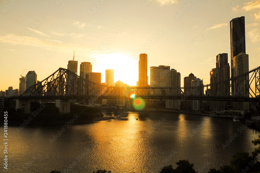 Skyline of Brisbane with Story Bridge during sunset in the background right before dawn during summer (Brisbane, Queensland, Australia)