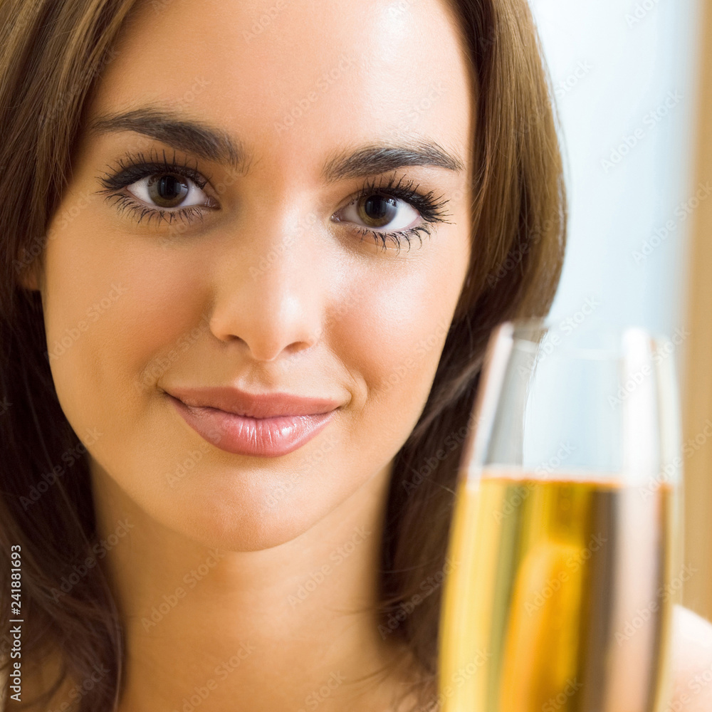 Woman with glass of champagne, at home Woman with glass of champagne, at home