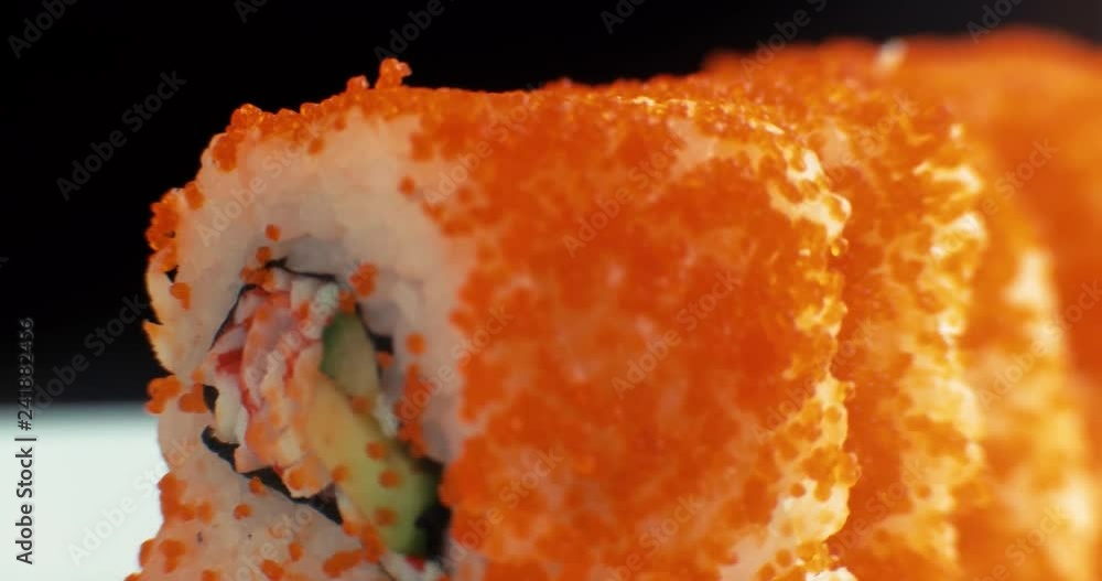 Slide motion of sushi food served on white plate. Macro. 4K.
Slide motion of sushi food served on white plate. Macro. 4K.