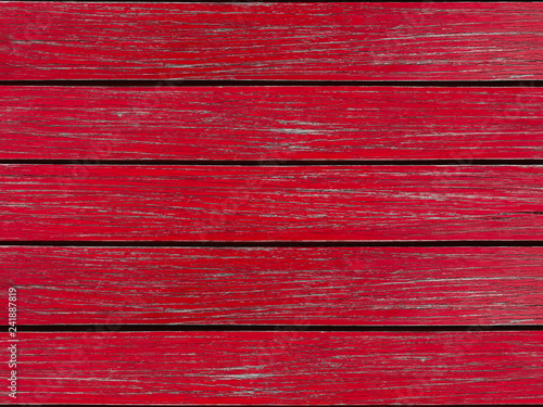 Natural painted red wood panels table texture wall background.
